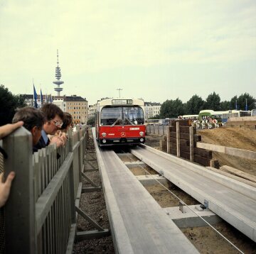 Track-guided buses shown in use