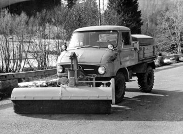 Unimog, model series 411 with water tank and Schmidt sweeper attachment