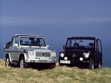 Mercedes-Benz 240 GD convertible, off-road vehicle, short wheelbase, 460 model series, 1979 - 1982 version (pictured on right). G 400 CDI Cabriolet, 463 model series, 2004. Brilliant silver metallic, black soft top, black leather. Spare wheel cover in stainless steel, stainless steel running boards on left and right (optional extras).