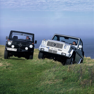 Mercedes-Benz 240 GD convertible, off-road vehicle, short wheelbase, 460 model series, 1979 - 1982 version (pictured on the left). G 400 CDI Cabriolet, 463 model series, 2004. Brilliant silver metallic, black soft top, black leather. Spare wheel cover in stainless steel, stainless steel running boards on left and right (optional extras).