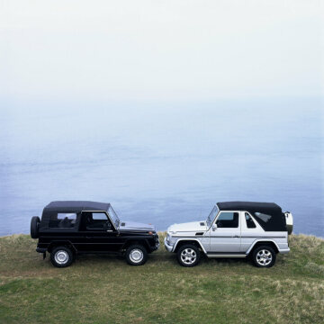 Mercedes-Benz 240 GD convertible, off-road vehicle, short wheelbase, 460 model series, 1979 - 1982 version (pictured on the left). G 400 CDI Cabriolet, 463 model series, 2004. Brilliant silver metallic, black soft top, black leather. Spare wheel cover in stainless steel, stainless steel running boards on left and right (optional extras).