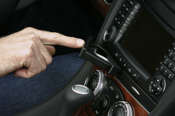 Mercedes-Benz SL, 230 series, 2006 version. Interior, wood version walnut root with new grain, operation of double cupholder with pleasant haptics