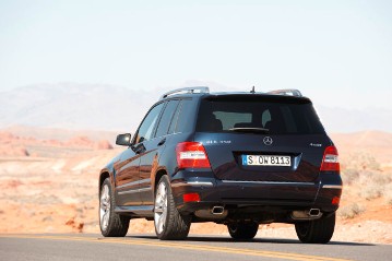 Mercedes-Benz GLK 350 4MATIC, compact SUV, model series 204, 2008, tanzanite blue metallic, alpaca grey interior. Optional equipment: electric panoramic glass sunroof, dark tinted glass in the rear, Exterior Sports package (including Exterior Chrome package) with chrome roof rails, three louvres in radiator grille, front/rear aprons and sideskirts in the vehicle colour. Optional 20-inch 5-twin-spoke light-alloy wheels.