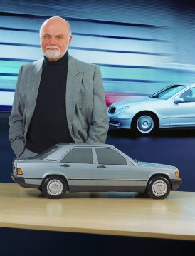 Bruno Sacco, born in Udine (Italy) on November 12th, 1933.
He worked as a constructor and car designer at Mercedes-Benz since 1958. Until 1999 he was responsible for designing the Mercedes-Benz passenger cars. 
The photograph shows Bruno Sacco with a car model of the Mercedes-Benz series 201 compact class, produced from 1982 to 1988. In the background - Mercedes-Benz series 203 C-class sedan, produced 2000 - 2003.