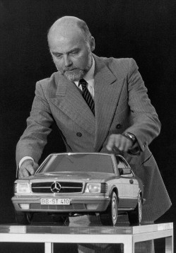 Bruno Sacco, born in Udine (Italy) on November 12th, 1933.
He worked as a constructor and car designer at Mercedes-Benz since 1958. Until 1999 he was responsible for designing the Mercedes-Benz passenger cars. 
Here he is showing a car model of the Mercedes-Benz, 126 series S-class coupé, production: 1981 - 1985.